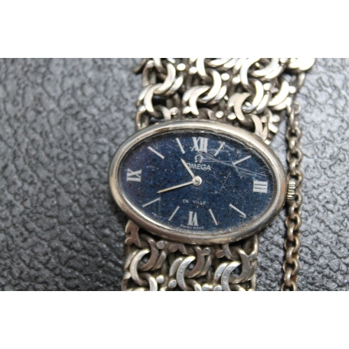 162 - AN OVAL OMEGA DE VILLE WRIST WATCH ON SILVER LINK BRACELET, Dia 3.25 cm