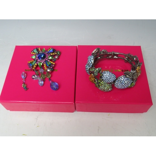 18 - A BUTLER AND WILSON FRUIT THEMED CRYSTAL SET HINGED BANGLE, together with three smaller floral brooc... 