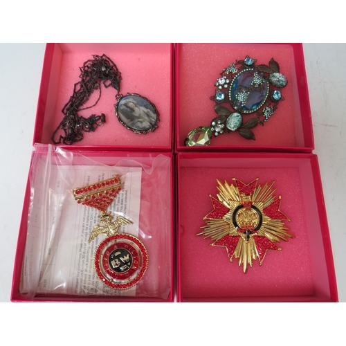 19 - TWO BUTLER AND WILSON MILITARY THEMED BROOCHES, the medal style brooch L 9 cm, together with a large... 