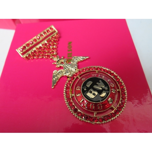 19 - TWO BUTLER AND WILSON MILITARY THEMED BROOCHES, the medal style brooch L 9 cm, together with a large... 