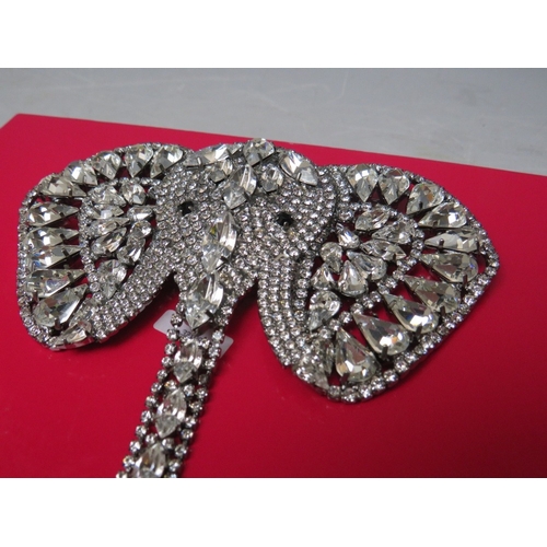 27 - A LARGE BUTLER AND WILSON CLEAR DIAMANTE ELEPHANT BROOCH, with articulated trunk, W 11.5 cm