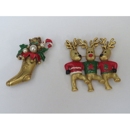 31 - A COLLECTION OF BUTLER AND WILSON CHRISTMAS THEMED BROOCHES, comprising a large Santa brooch and fiv... 