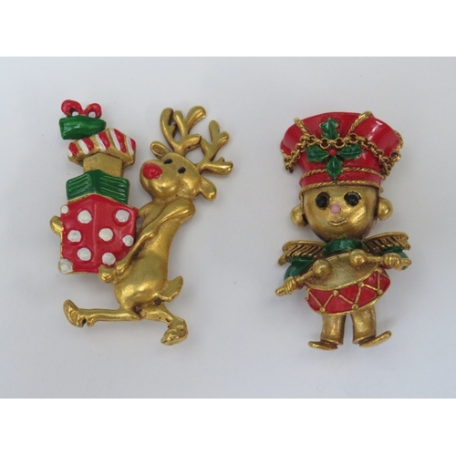 31 - A COLLECTION OF BUTLER AND WILSON CHRISTMAS THEMED BROOCHES, comprising a large Santa brooch and fiv... 