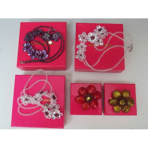 34 - THREE FLORAL FACETED GLASS BEAD NECKLACES, together with two cabochon / bead flower brooches (5)