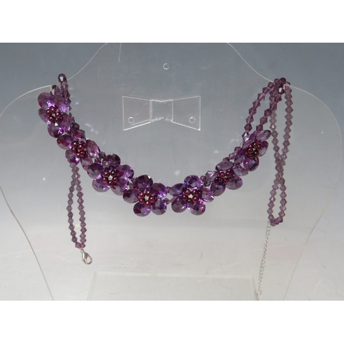 34 - THREE FLORAL FACETED GLASS BEAD NECKLACES, together with two cabochon / bead flower brooches (5)