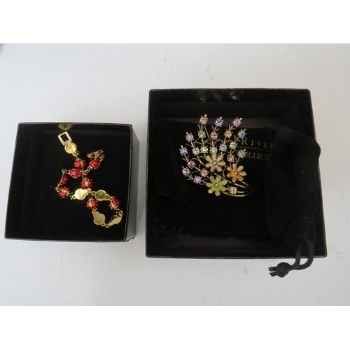 50 - A COLLECTION OF JOAN RIVERS JEWELLERY ITEMS, to include two gilt & enamel hinged bangles, a pear the... 