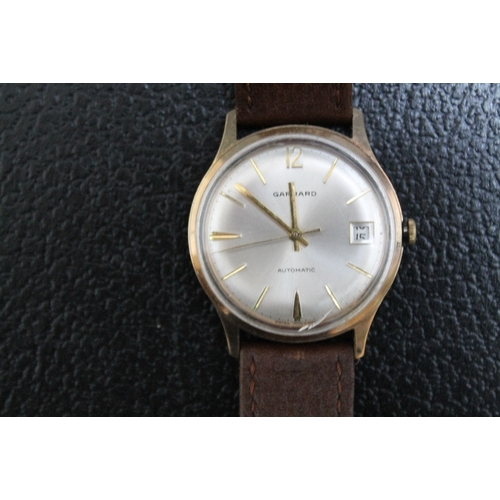 175 - A 9 CARAT GOLD GARRARD WRIST AUTOMATIC DATE WRIST WATCH, Dia 3.5 cmCondition Report:presentation eng... 