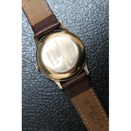 175 - A 9 CARAT GOLD GARRARD WRIST AUTOMATIC DATE WRIST WATCH, Dia 3.5 cmCondition Report:presentation eng... 