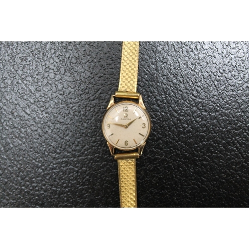 177 - A 9 CARAT GOLD LADIES OMEGA WRIST WATCH, on replacement plated strap and lacking winder, Dia 2 cm