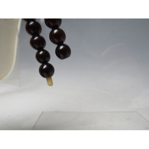 62 - A CHERRY RED FATURAN AMBER GRADUATED CIRCULAR BEAD NECKLACE, approx L 44 cm, approx weight 35 g