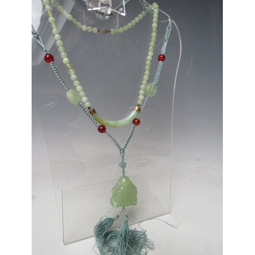 63 - A MODERN JADE BEAD NECKLACES WITH YELLOW METAL MOUNTS, the clasp marked 9K, together with a modern j... 