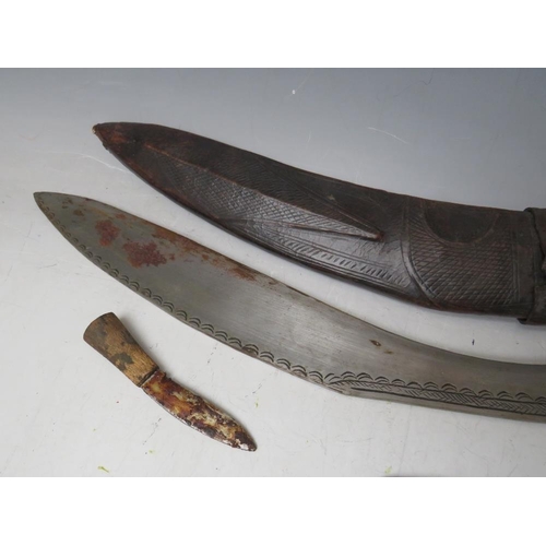 220 - A GURKHA KUKRI KNIFE IN LEATHER COVERED SHEATH, and with two smaller knives, blade L 41 cm, overall ... 