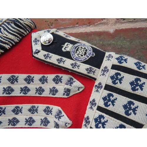 223 - A GRENADIER GUARDS DRUMMERS RED PARADE TUNIC, GG drummers decoration to chest and Queens crown stay ... 