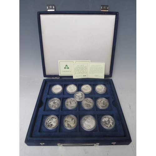 145 - CHINA - A COLLECTION OF MODERN SILVER PROOF 5 AND 10 YUAN COINS, in a blue presentation box (25 coin... 