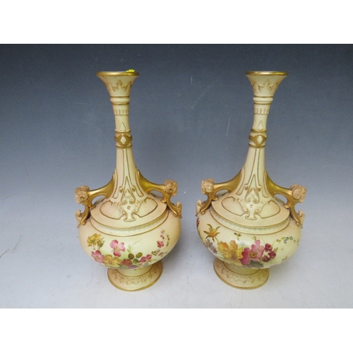 197 - A PAIR OF  ROYAL WORCESTER BLUSH IVORY TWIN HANDLED VASES, decorated with flowers and rams head deta... 