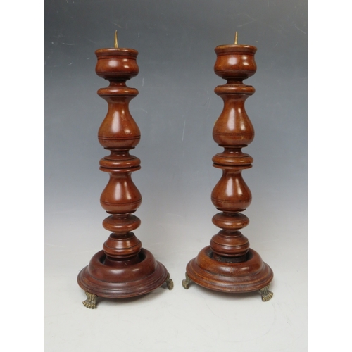 205 - A PAIR OF 19TH CENTURY TURNED WALNUT PRICKET CANDLESTICKS, H 32 cm