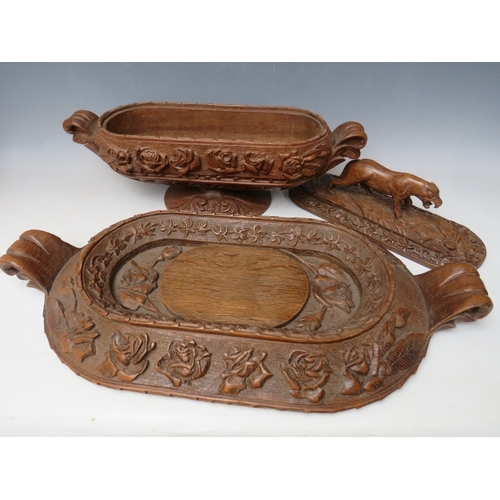 207 - A LARGE BLACK FOREST CARVED LIDDED DISH ON A CARVED BASE, the handle in the shape if a wild animal, ... 