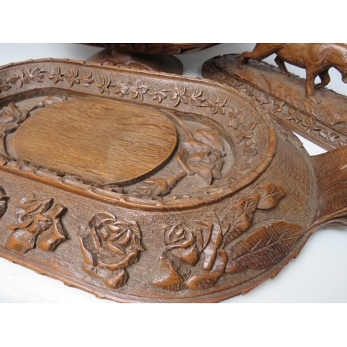 207 - A LARGE BLACK FOREST CARVED LIDDED DISH ON A CARVED BASE, the handle in the shape if a wild animal, ... 