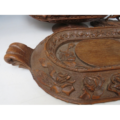 207 - A LARGE BLACK FOREST CARVED LIDDED DISH ON A CARVED BASE, the handle in the shape if a wild animal, ... 