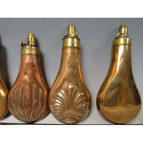 216 - FIVE 19TH CENTURY COPPER AND BRASS SHOT FLASKS, average L 19 cm