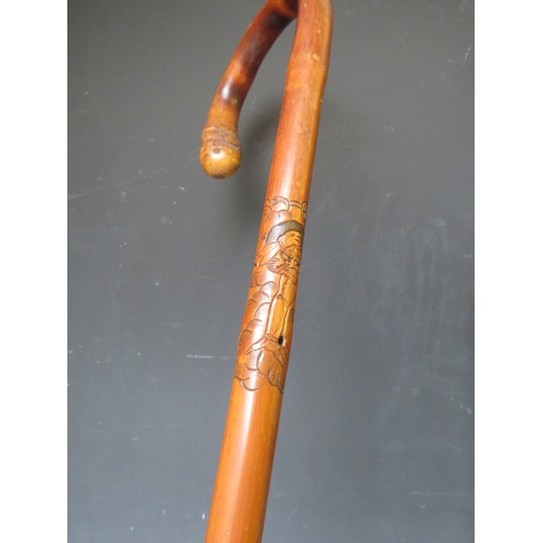 232 - A VINTAGE EASTERN CARVED MALACCA WALKING STICK, L 88 cm, together with another walking stick (2)