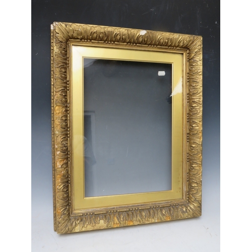 26 - A 19TH CENTURY GOLD FRAME, with gold slip and outer leaf design, glazed, with some restoration, fram... 