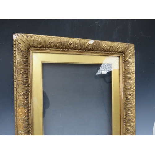 26 - A 19TH CENTURY GOLD FRAME, with gold slip and outer leaf design, glazed, with some restoration, fram... 