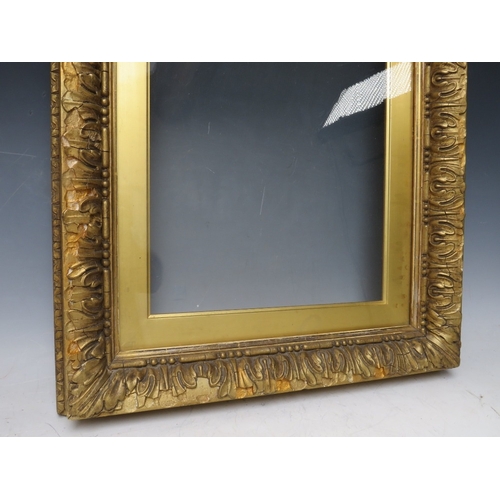 26 - A 19TH CENTURY GOLD FRAME, with gold slip and outer leaf design, glazed, with some restoration, fram... 