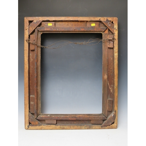 28 - A 19TH CENTURY DECORATIVE GOLD SWEPT FRAME, frame W 10 cm, rebate 53 x 45 cm