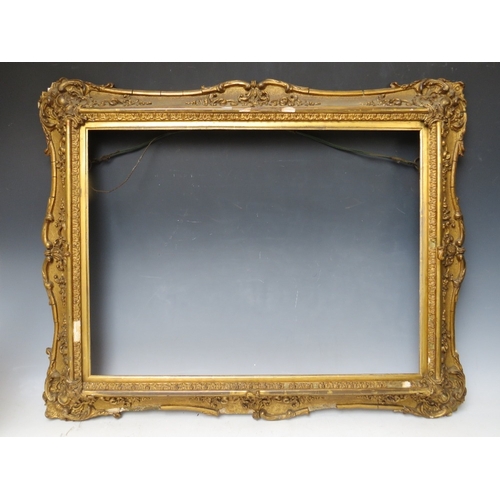 29 - A 19TH CENTURY DECORATIVE GOLD SWEPT FRAME, with gold slip, frame W 8 cm, slip rebate 45 x 60, frame... 