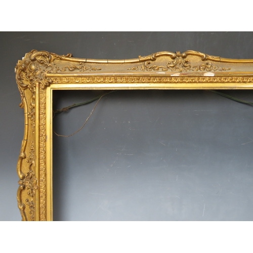 29 - A 19TH CENTURY DECORATIVE GOLD SWEPT FRAME, with gold slip, frame W 8 cm, slip rebate 45 x 60, frame... 