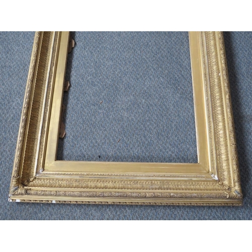 31 - A 19TH CENTURY DECORATIVE GOLD FRAME, with gold slip, frame W 9 cm, slip rebate 60 x 47 cm, frame re... 