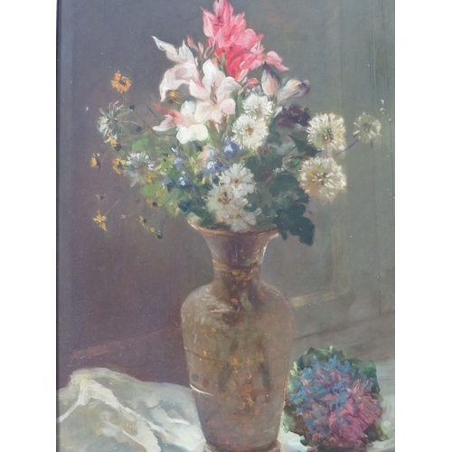 63 - JULES RAGOT (XIX-XX). French school, still life study of a vase of flowers on a ledge, signed lower ... 