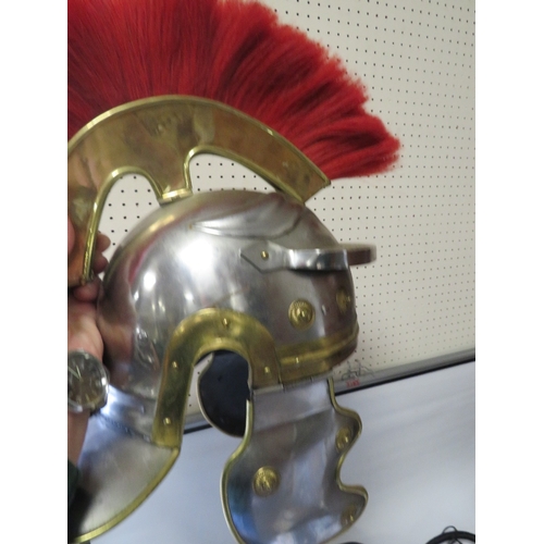 374 - A REPRODUCTION ROMAN CENTURION HELMET TOGETHER WITH A TRAY OF HATS AND ACCESSORIES