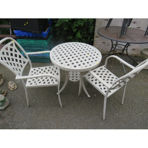 704 - A CAST ALUMINIUM THREE PIECE PATIO BISTRO GARDEN SET COMPRISING TABLE & TWO CHAIRS