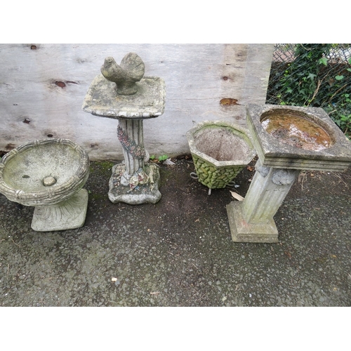 706 - FOUR GARDEN CONCRETE ORNAMENTS TO INCLUDE PLANTERS AND A BIRD BATH
