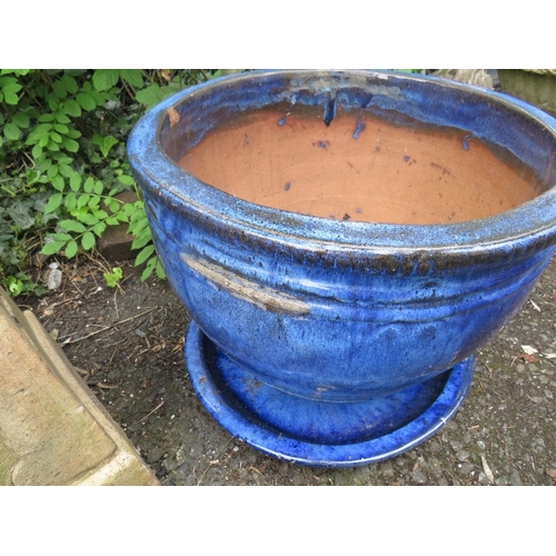 707 - FOUR ITEMS TO INCLUDE LARGE CERAMIC PLANTERS AND A CASTLE TYPE CHIMNEY POT