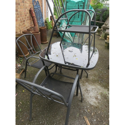 710 - A MODERN FIVE PIECE GARDEN TABLE AND STACKING CHAIRS