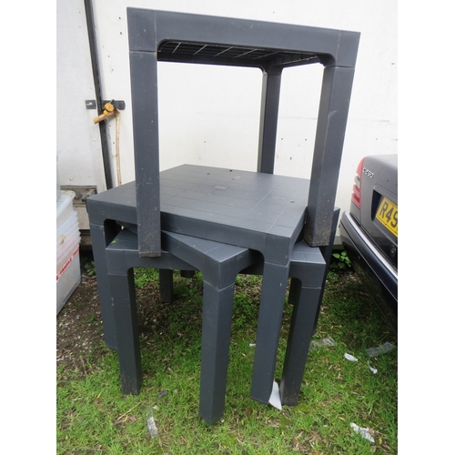 712 - A SELECTION OF FOUR PLASTIC GARDEN TABLES