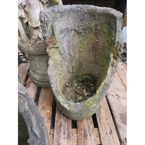 714 - A CONCRETE STATUE ON PLINTH AND THREE RUSTIC CONCRETE PLANTERS