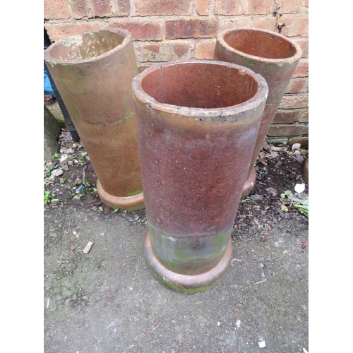 717 - THREE TERRACOTTA CHIMNEY POT PLANTERS