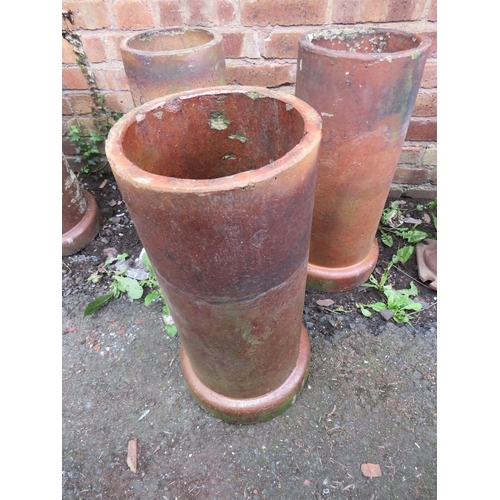 718 - THREE TERRACOTTA CHIMNEY POT PLANTERS