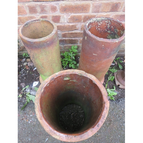 718 - THREE TERRACOTTA CHIMNEY POT PLANTERS