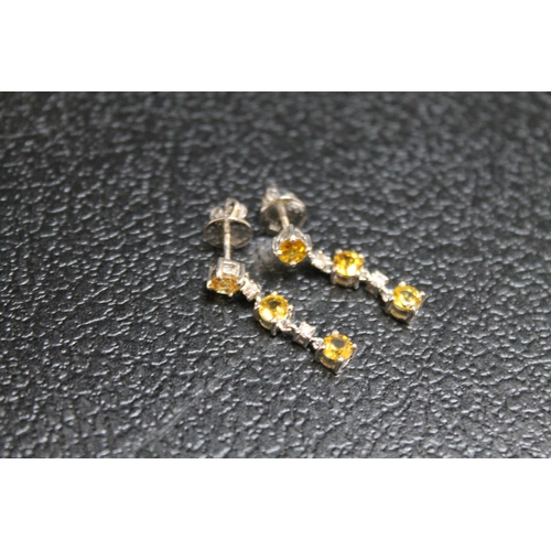 92 - A PAIR OF EARRINGS SET WITH CITRINE STYLE STONES AND DIAMONDS, just butterflies stamped 750, approx ... 