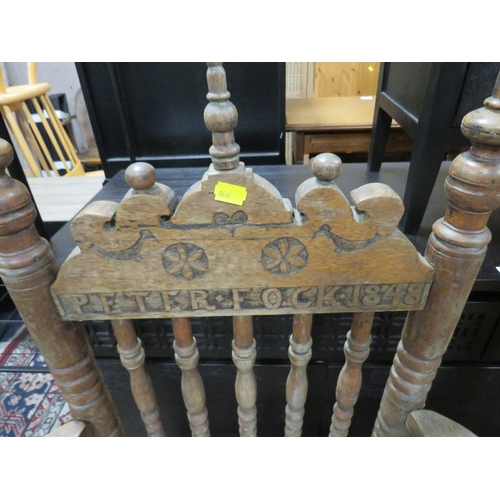 837 - A PAIR OF ANTIQUE CARVED OAK ARMCHAIRS