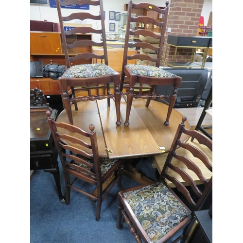 859 - AN EXTENDING ERCOL STYLE DINING TABLE WITH SIX CHAIRS