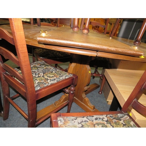 859 - AN EXTENDING ERCOL STYLE DINING TABLE WITH SIX CHAIRS