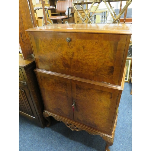 877 - A VINTAGE WALNUT DRINKS CABINET