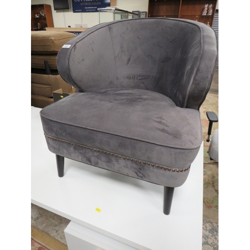 892 - A MODERN GREY SUEDE ARMCHAIR