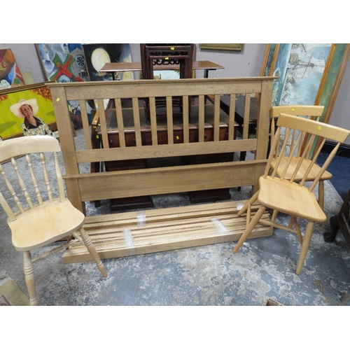 907 - A MODERN OAK BED FRAME ALONG WITH THREE KITCHEN CHAIRS